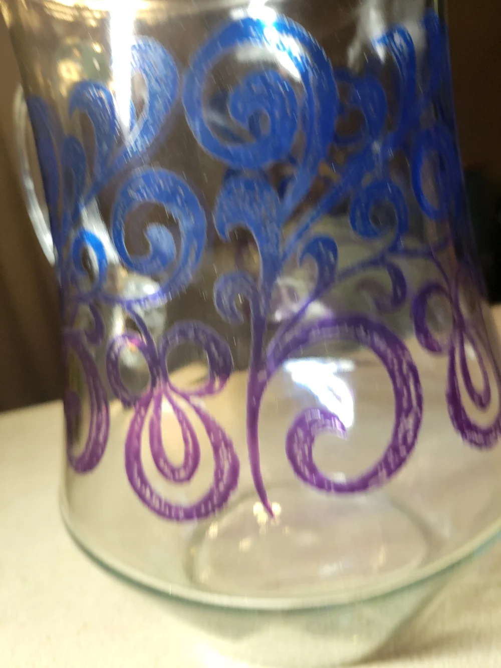 Vintage Glass Pitcher with Blue & Purple Scroll Design